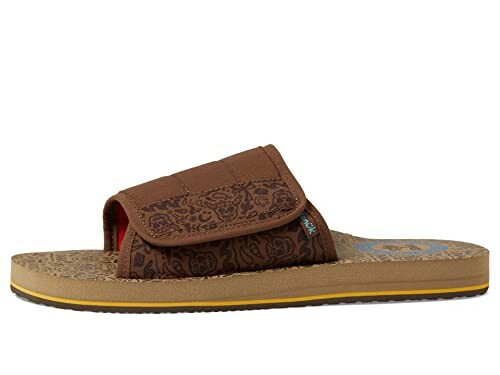 Brown sandal with patterned strap and textured sole