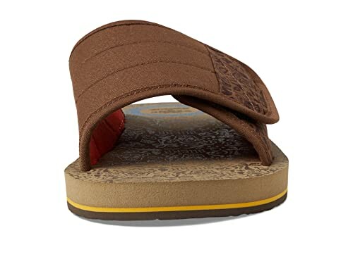 Brown slide sandal with decorative sole and strap