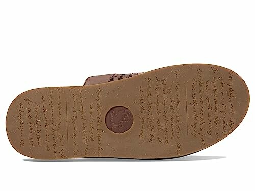 Brown shoe sole with text imprint